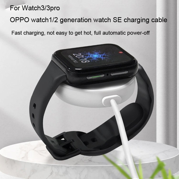 Magnetic charging puck cable resting on smartwatch with charging port connection