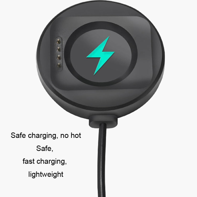 Black magnetic charging puck with visible contact pins for watch charging