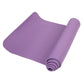 Purple rolled yoga mat with textured grip surface