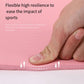 Pink yoga mat surface pressed by a hand, cushioned and flexible