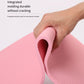Pink yoga mat edge showing ribbed texture and rolled cushioning