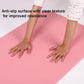 Pink yoga mat with non-slip textured surface for yoga practice