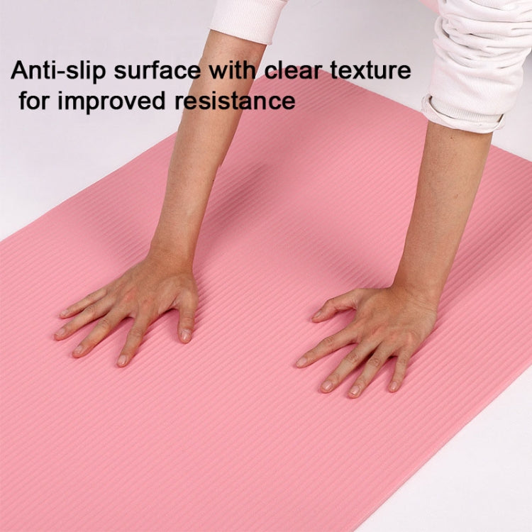 Pink yoga mat with non-slip textured surface for yoga practice