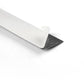 Close-up of black sticker strip edge with protective gray backing
