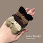 Bow stretch hair bands set in black, brown, and cream tones