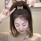 Beige bow hair band on hair, stretch fabric bow hair tie for women