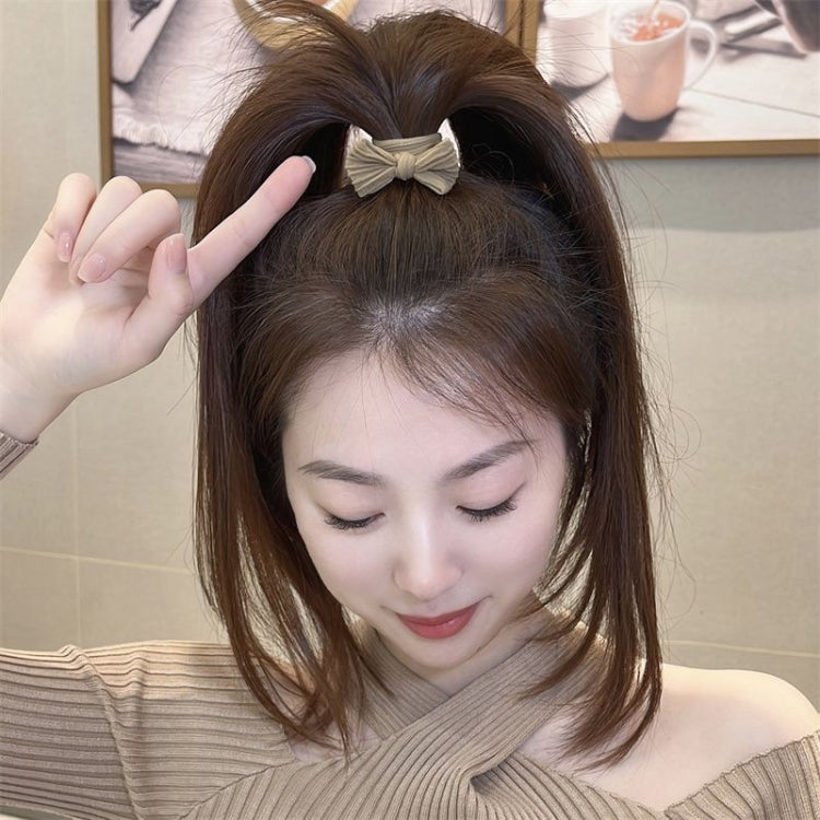 Beige bow hair band on hair, stretch fabric bow hair tie for women