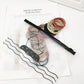 Stretchy nylon hair rings in a pile, multicolor elastic bands