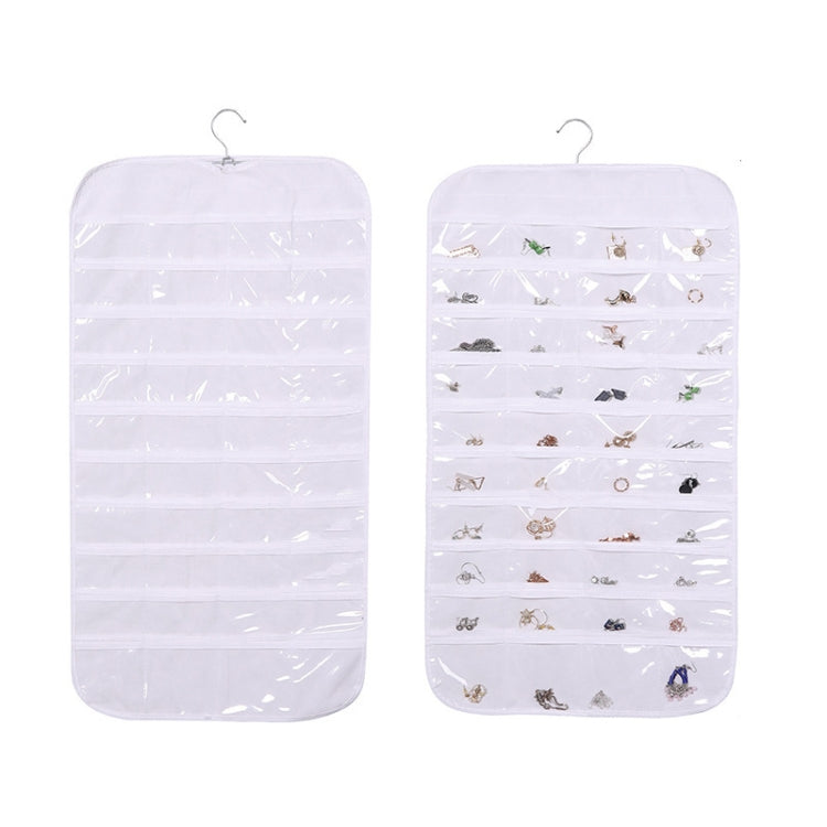 White hanging jewelry organizer bag with transparent grid compartments