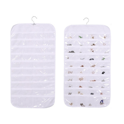 White hanging jewelry organizer bag with transparent grid compartments