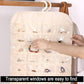 Cream hanging jewelry organizer bag with transparent pockets and hanging hooks