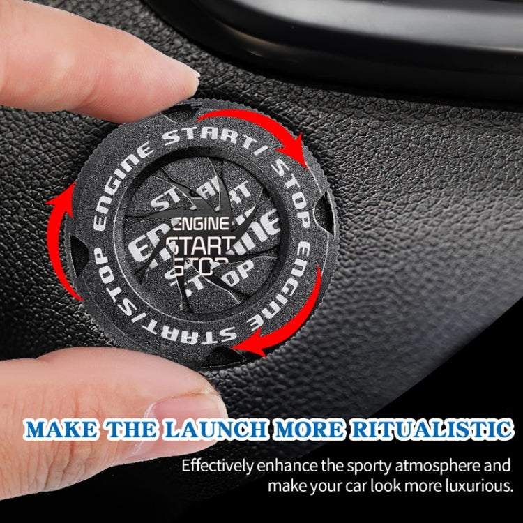 Black engine start/stop protective cover with arrows showing rotation