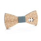 Wooden bow tie with puzzle-piece pattern, blue fabric center, tan wooden wings