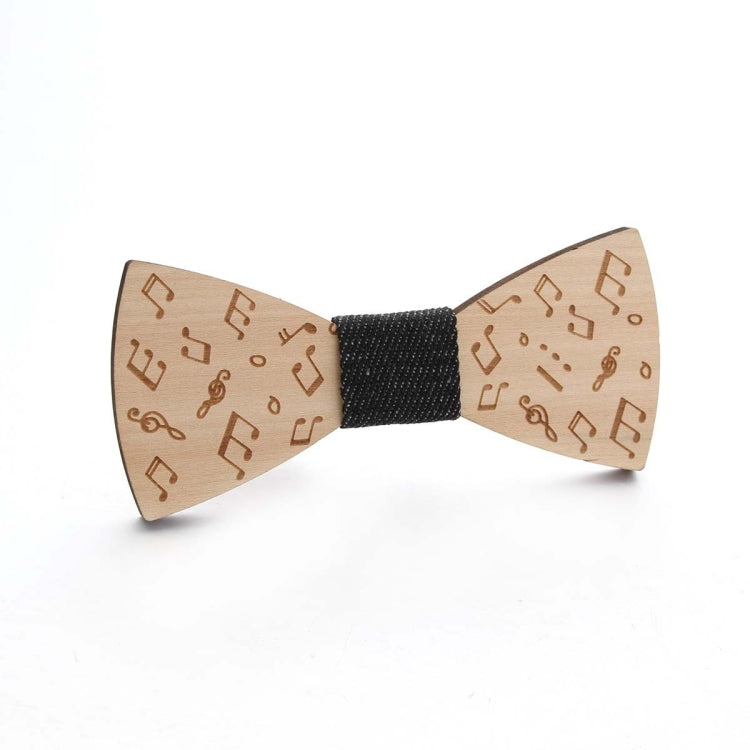 Wooden bow tie with music-note pattern, black fabric center, tan wooden wings