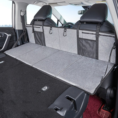 Gray folding car camping bed extension board with storage pockets for SUV rear row
