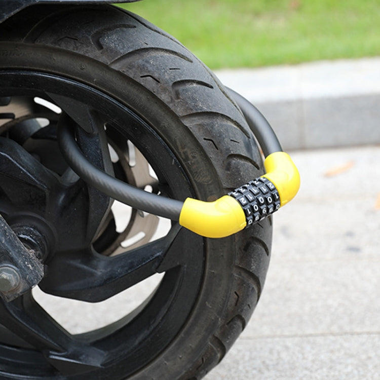 Yellow and black combination lock cable secured around a bike tire