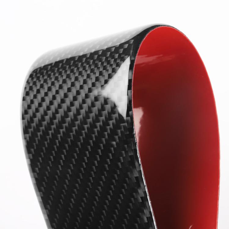 Black carbon-fiber instrument sticker with red border, curved corner close-up