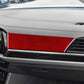Red carbon-fiber style dashboard instrument sticker strip on car interior trim