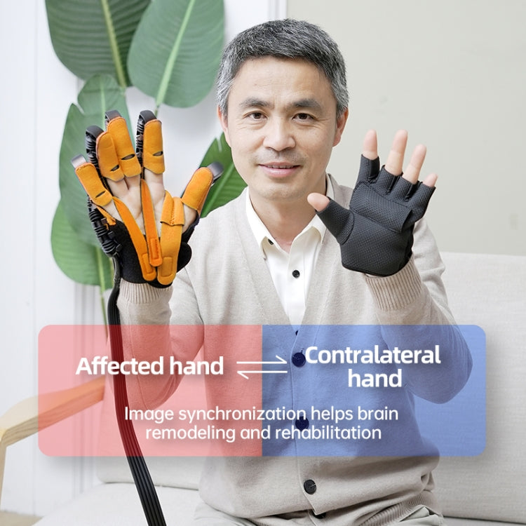 Pair of robotic rehab gloves in orange and black on a seated person’s raised hands