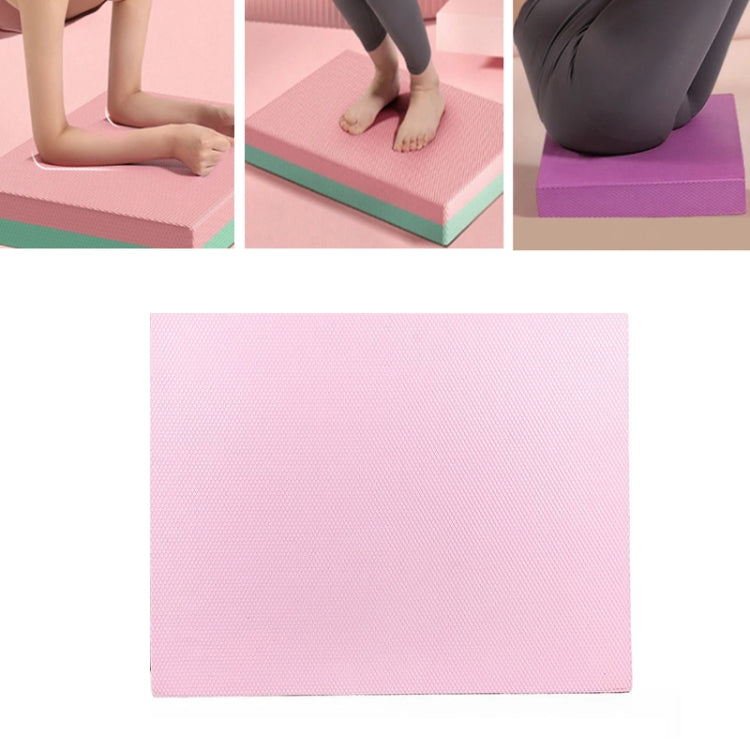 Turquoise non-slip balance mat, flat rectangular kneeling support.
