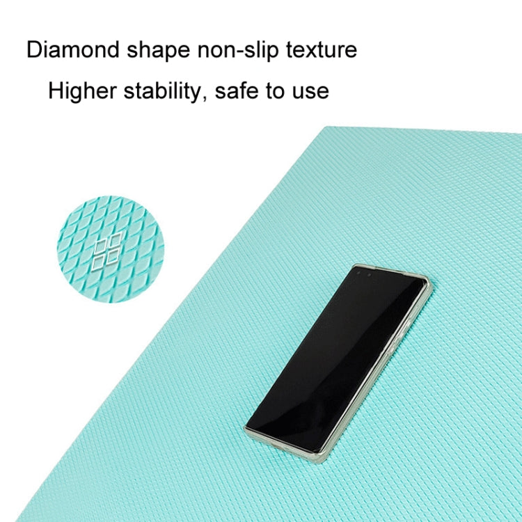 Turquoise diamond-textured balance mat with phone placed for grip and stability.