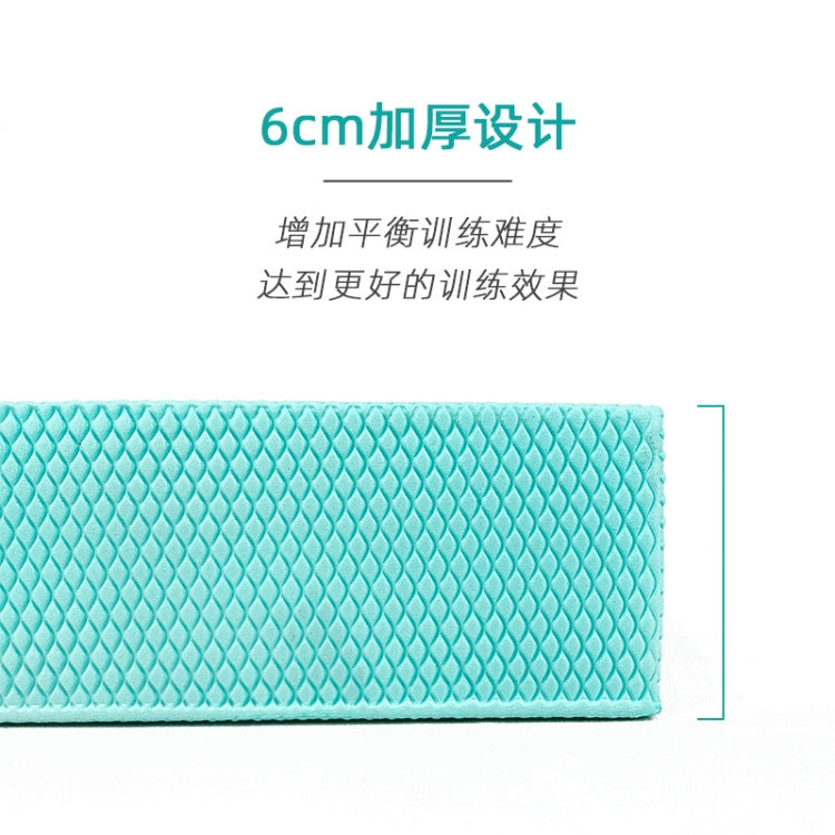 Turquoise balance mat showing 6cm thickness edge and textured anti-slip surface.