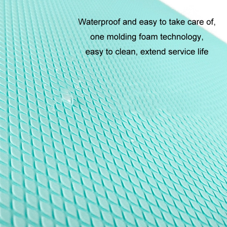 Turquoise balance mat close-up of diamond non-slip texture on the surface.