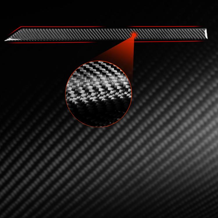 Carbon-fiber dashboard trim sticker with red outline accents.