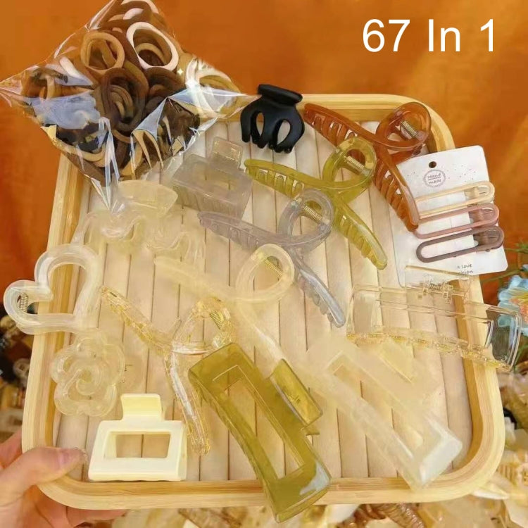 Hair clip and ring accessory set with clear, tan, and dark pieces in a box