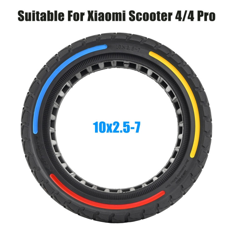 Off-road scooter tire, black tread with blue, yellow, and red rim stripes