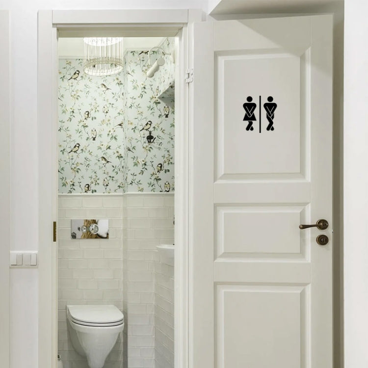 Bathroom door sticker with black restroom icons on white door panel