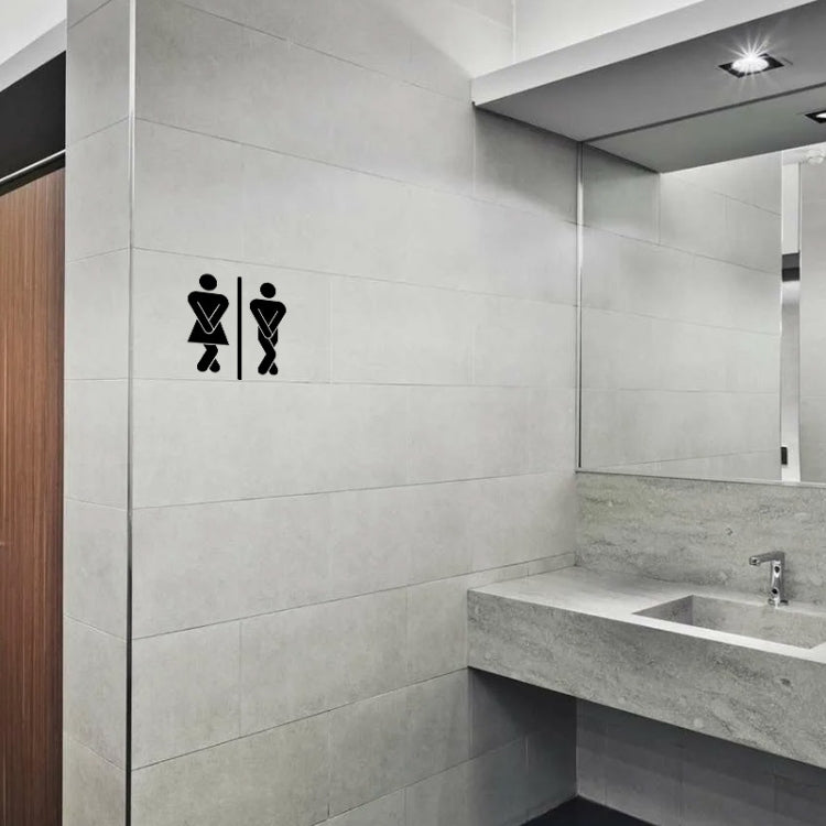 Bathroom door sticker with black restroom icons on light gray tiled wall