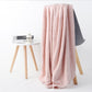 Light pink bath shower towel with waffle texture, full drape view
