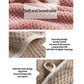 Pink bath towel fabric close-up showing textured weave and stitched border