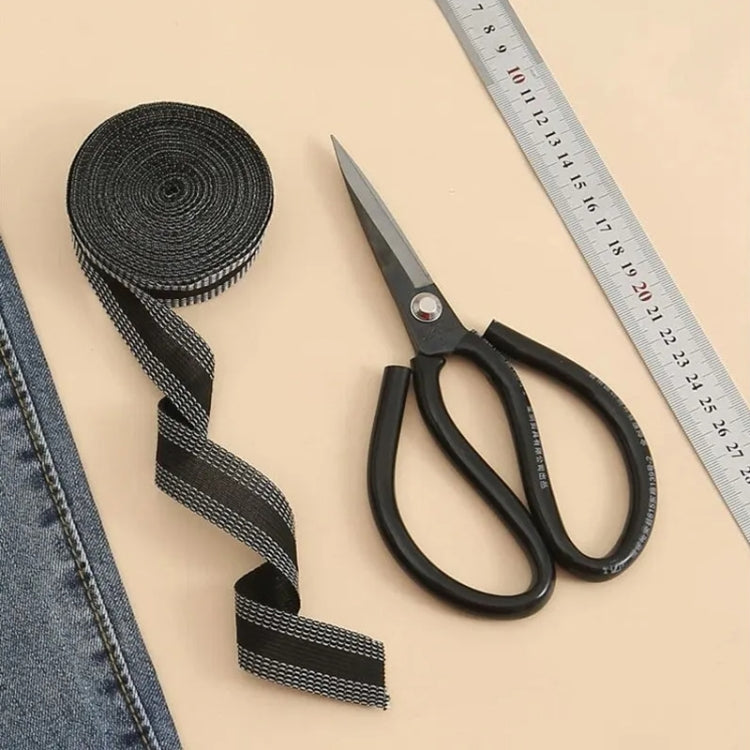 Iron-on pant leg tape stickers, dark gray roll and strip shown beside crafting tools