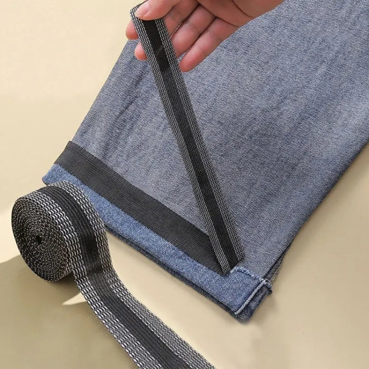 Iron-on pant leg tape stickers, dark gray strip placed along fabric edge with roll