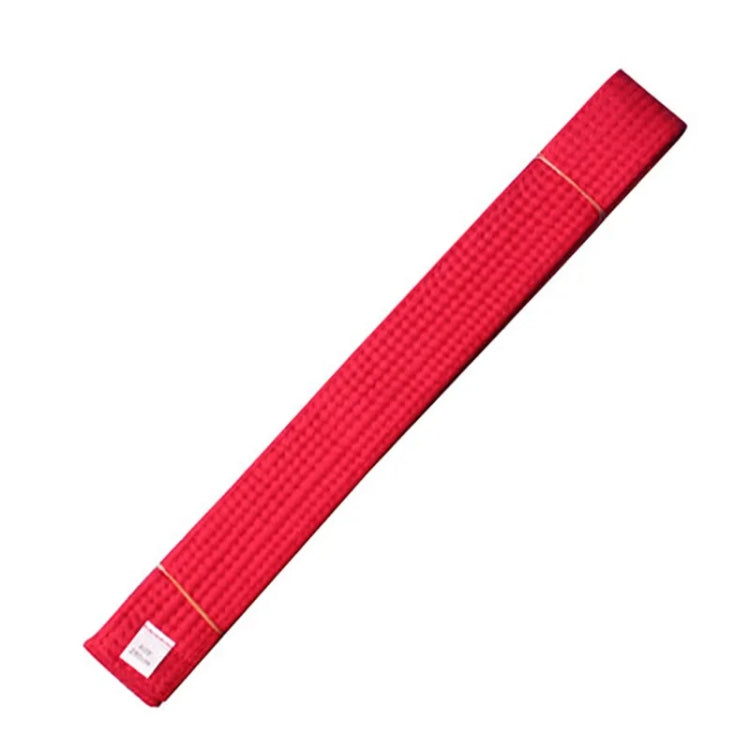 Red taekwondo belt sash with tan stitched edge and sewn end label