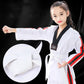 Black taekwondo belt tied on white martial arts uniform