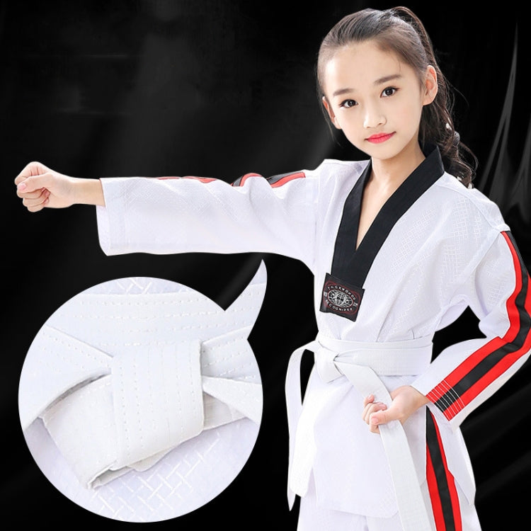 Black taekwondo belt tied on white martial arts uniform