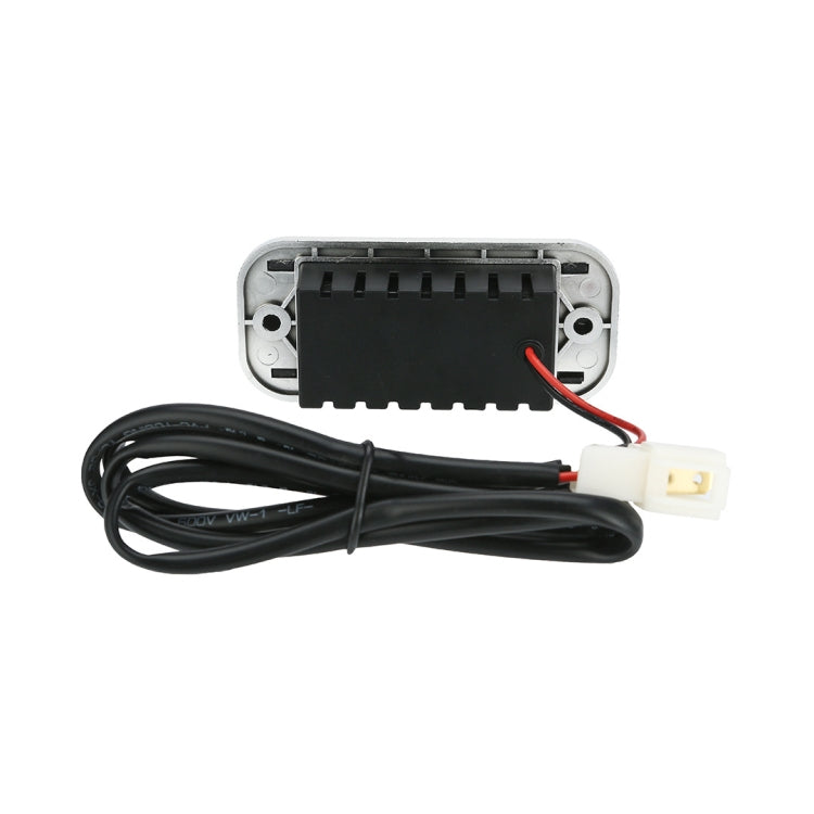 Silver USB car charger housing with internal board and attached wiring harness