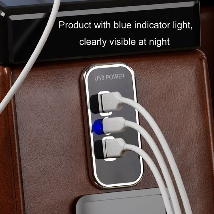 USB car charger with blue indicator light and three plugged USB cables