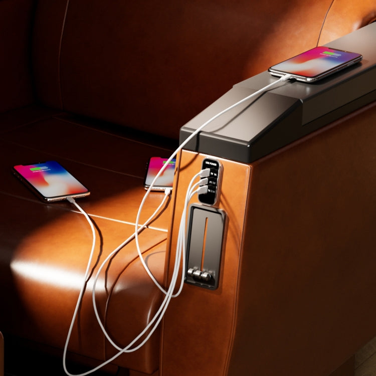 USB car charger with connected cables charging smartphones at a mounted panel