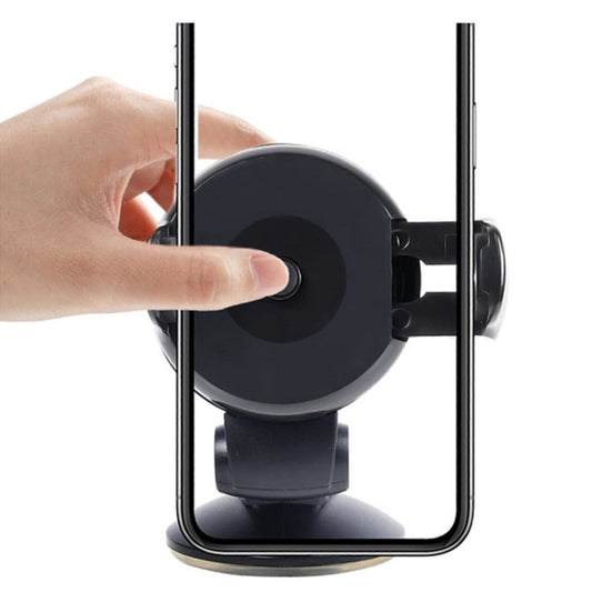 Black suction-cup phone holder with cradle ready for a smartphone; hand pressing base