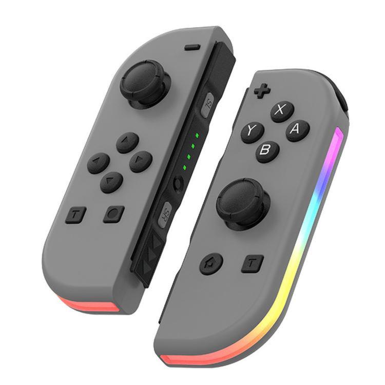 Gray left-right game controller set with twin thumbsticks and RGB light bar.