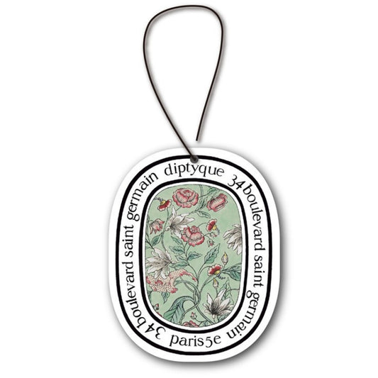 Aromatherapy car fragrance tablet card with circular floral medallion, red and green.