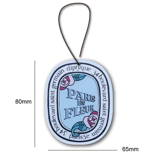 Hanging car fragrance tablet card with 'Paris en fleur' blue design, 80mm x 65mm.