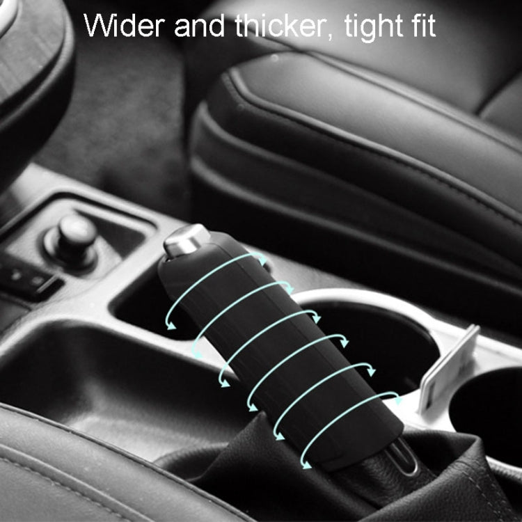 Black silicone handbrake handle cover installed on a car center console handbrake.