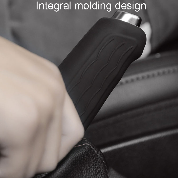Black silicone handbrake handle cover sleeve with embossed lines near the car interior.
