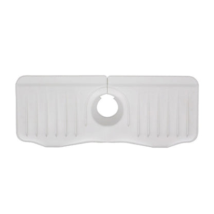 White silicone faucet anti-splash drain mat with central round outlet hole and ridged channels