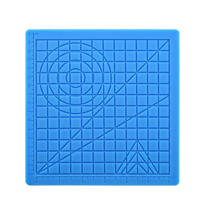 Blue silicone 3D drawing template mat with grid lines, circular guide, and ruler marks